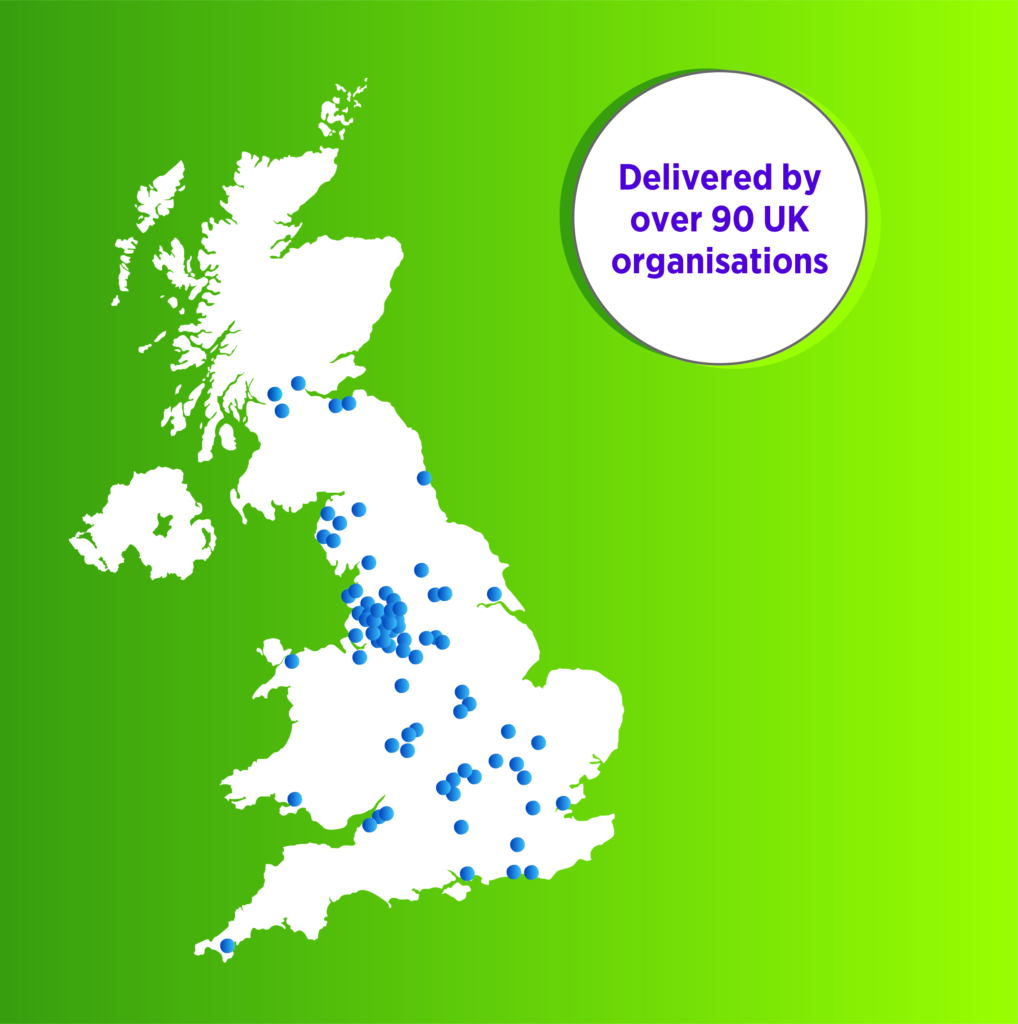 An infographic showing a white map of the UK over a green background. On the map are many blue dots indicating different locations across the country. Next to the map is a white circle with the text "Delivered by over 90 UK organisations".